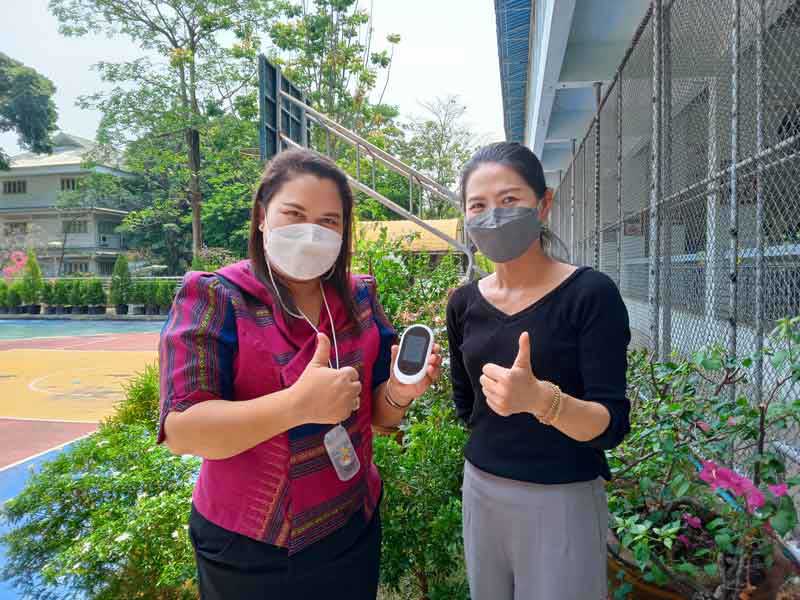 Teacher at Thung Maha Mek School for the Deaf using Pocketalk in the classroom